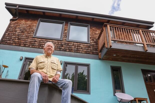 Mike Bradley, 83, sits in front of his ADU his son Casey built on the same lot in Berkeley, Calif., on Friday, May 24, 2023. (Ray Chavez/Bay Area News Group)