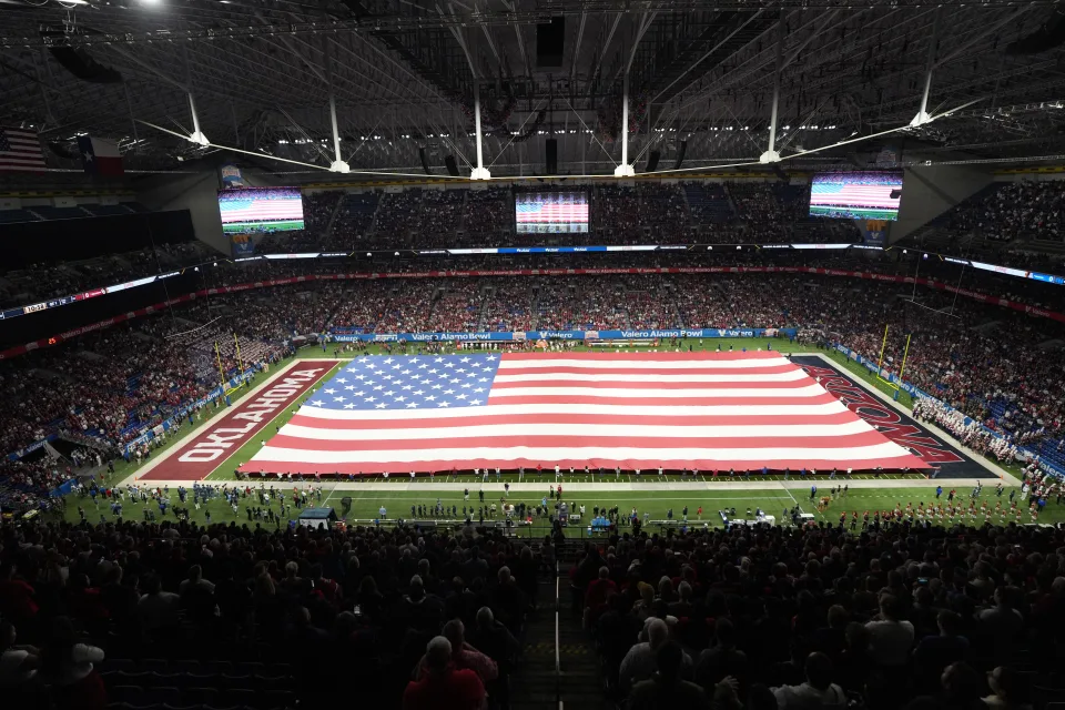 A general overall view of a United States flag on the field during the playing of the national anthem at the Alamo Bowl between the Arizona Wildcats and the Oklahoma Sooners at Alamodome. (Kirby Lee-USA TODAY Sports) · (USA TODAY Sports via Reuters Connect / Reuters)<br />
