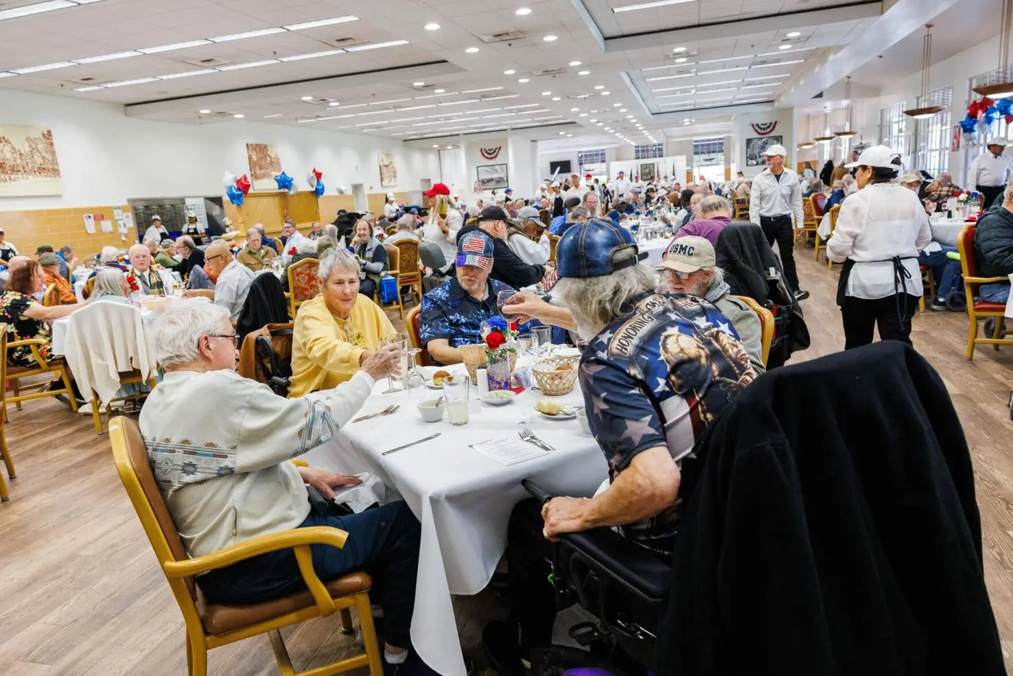 Guests cheer during the annual Celebrity Chefs luncheon for residents of the Yountville Veterans Home<br />
on Wednesday, Nov. 6.<br />
Nick Otto, Register