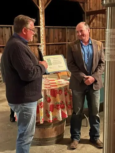 Andy Beckstoffer, founder Beckstoffer Vineyards, right, receives the Founders Award from the Fish Friendly Farming Certification Program.